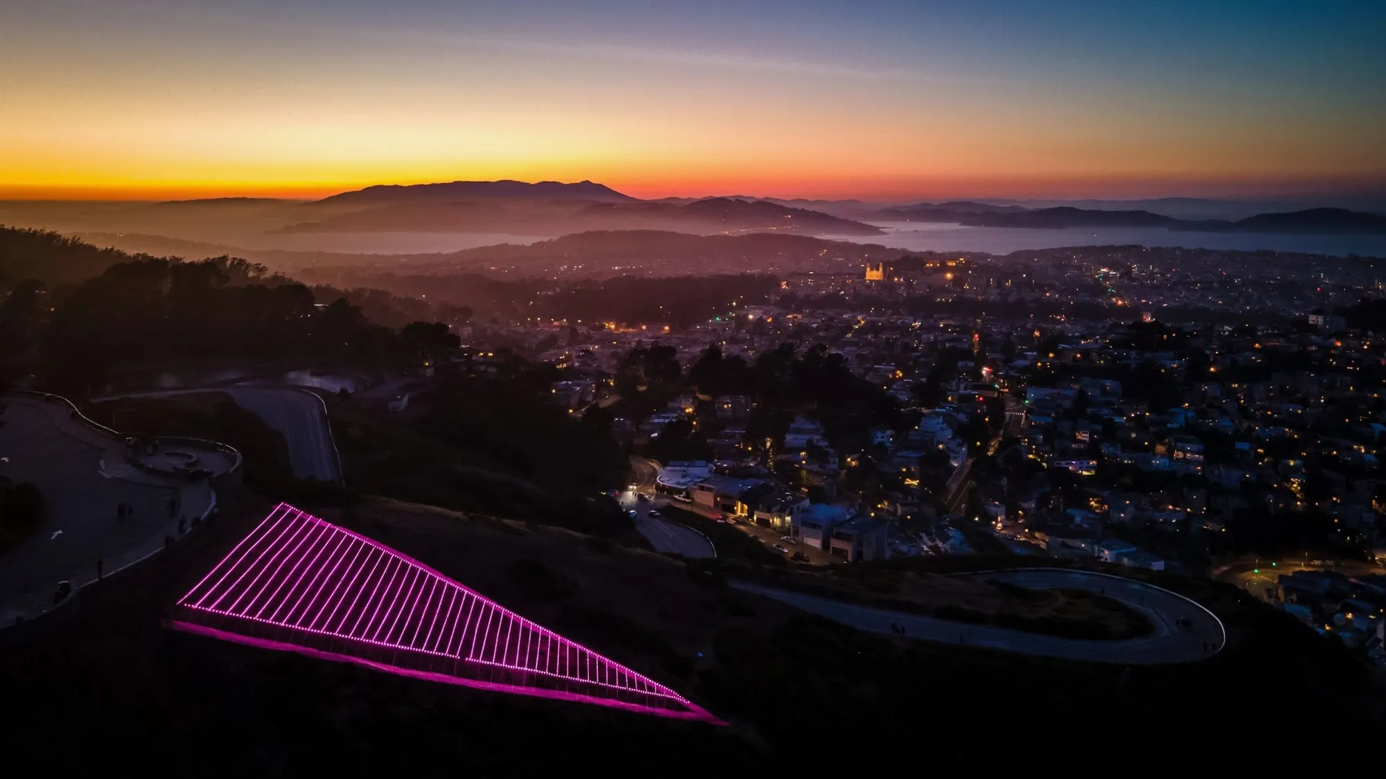 Pink Triangle LED installation illuminating Twin Peaks during Pride Month